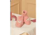Chaussons de naissance rose poudré