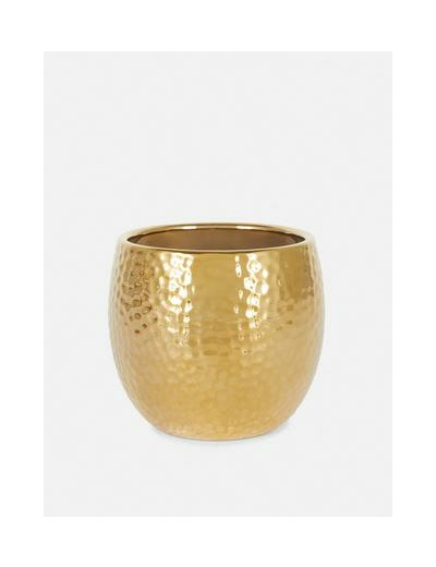 Bougie parfumée dans un pot en métal martelé