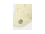 Casquette jaune brodée de palmiers