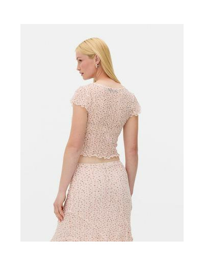 Haut à col en V et motif floral